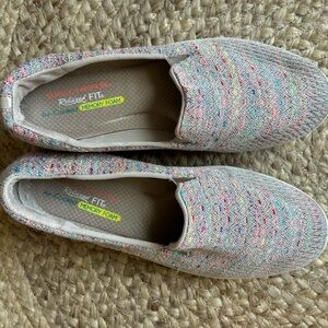 Skechers slip on tennis shoes.  Grey and multicolored.